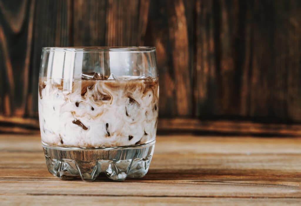White russian cocktail on a glass with ice