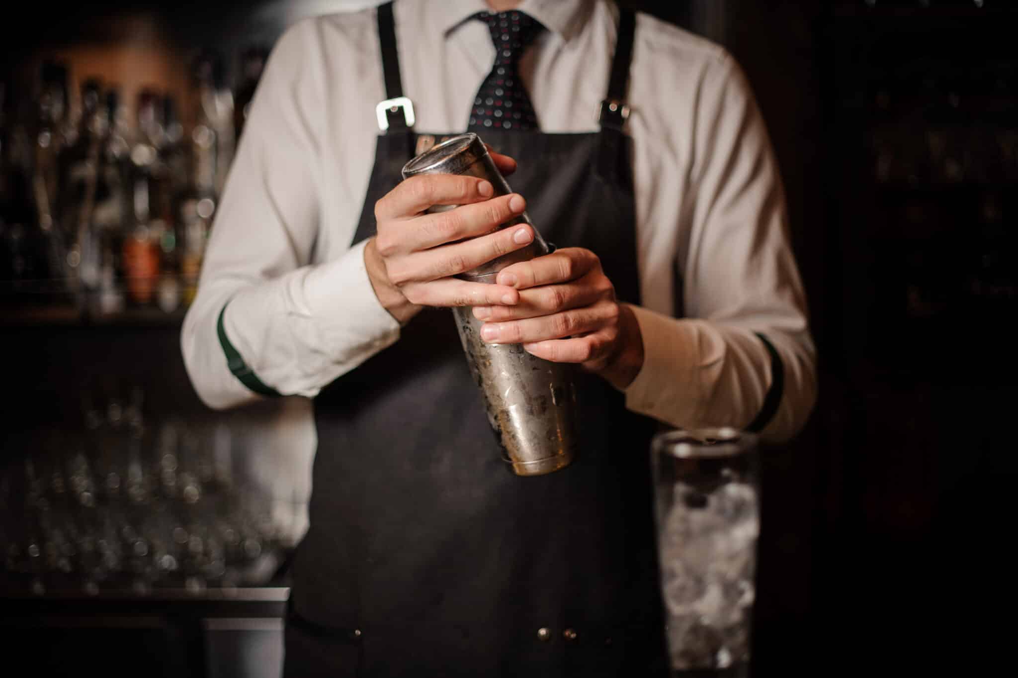 Bartender with a magic cocktail shaker from Magic&Cocktails