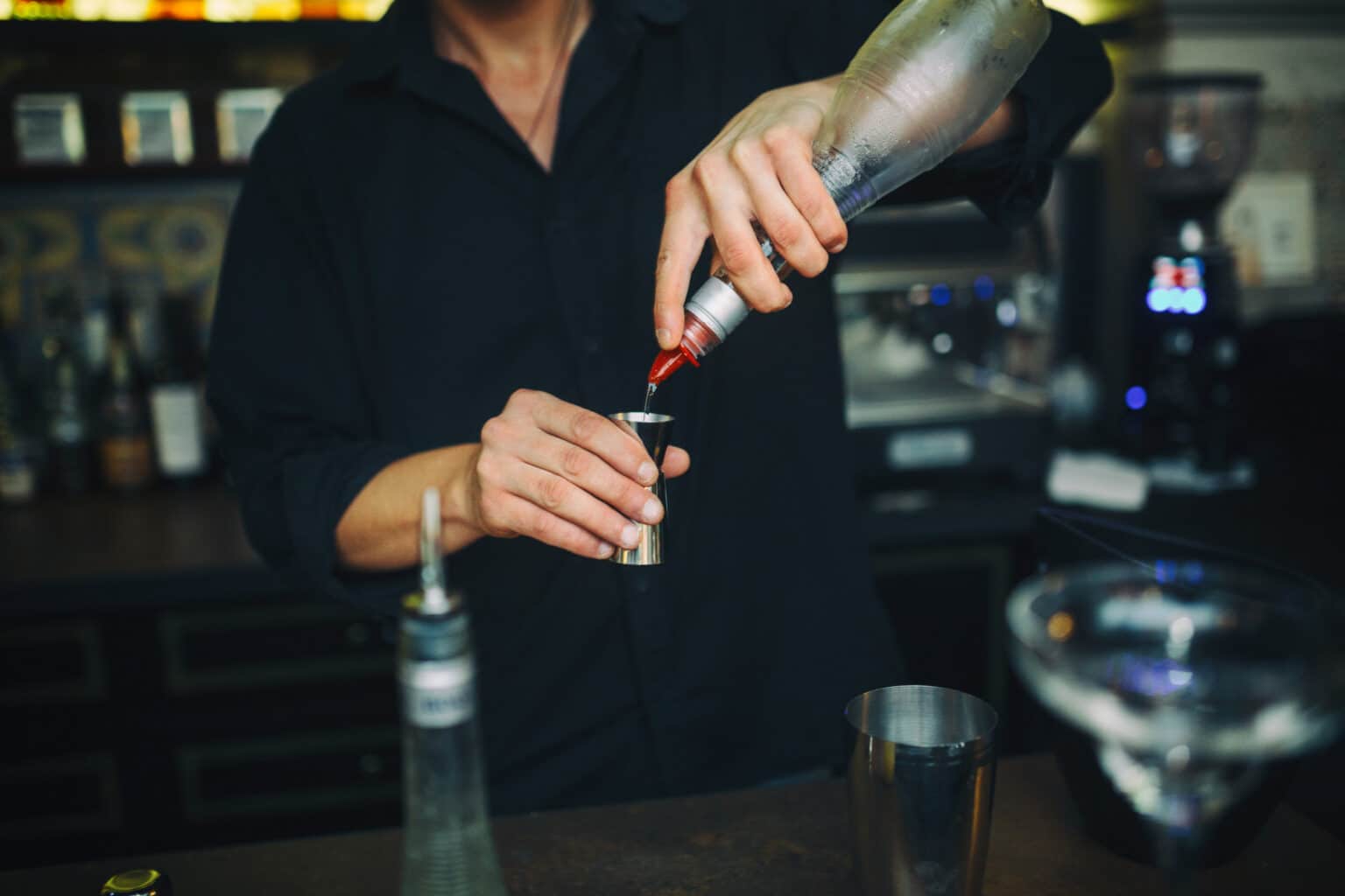bartender making a cocktail with gin or vodka
